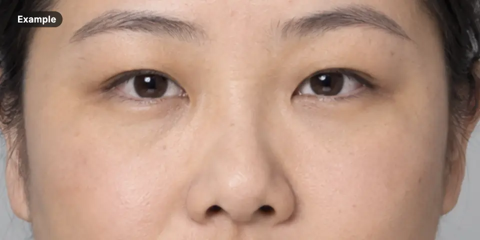 Example: close-up of the eye region of an AI-generated woman